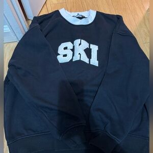 Black and white Sweater SKI - back side has a bleach stain -Will take any offer